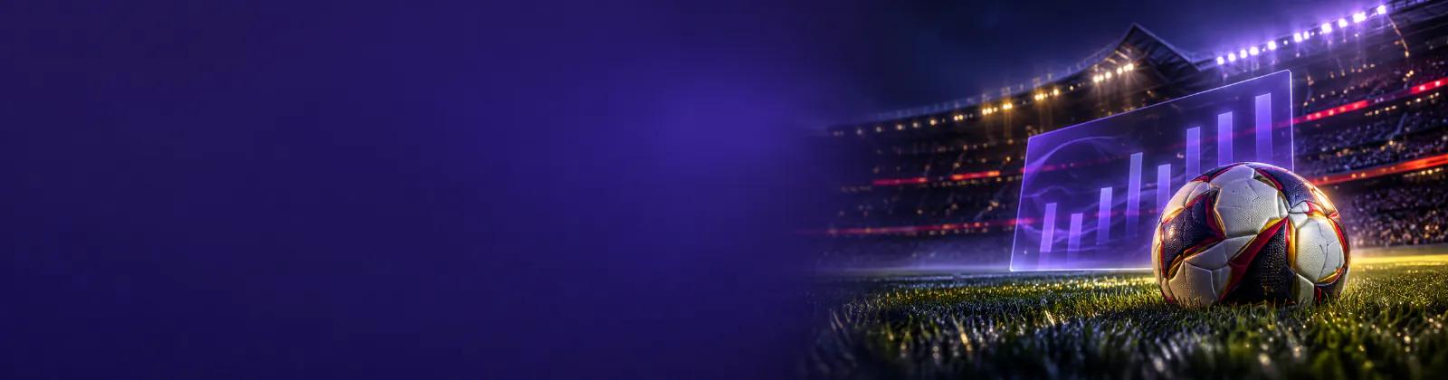 Balón sobre el césped iluminado de un estadio